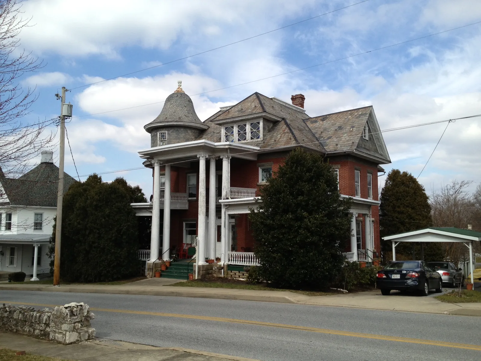 Clyfford Still’s gabled New Windsor house with a turret and columned porch beside a Maryland road
