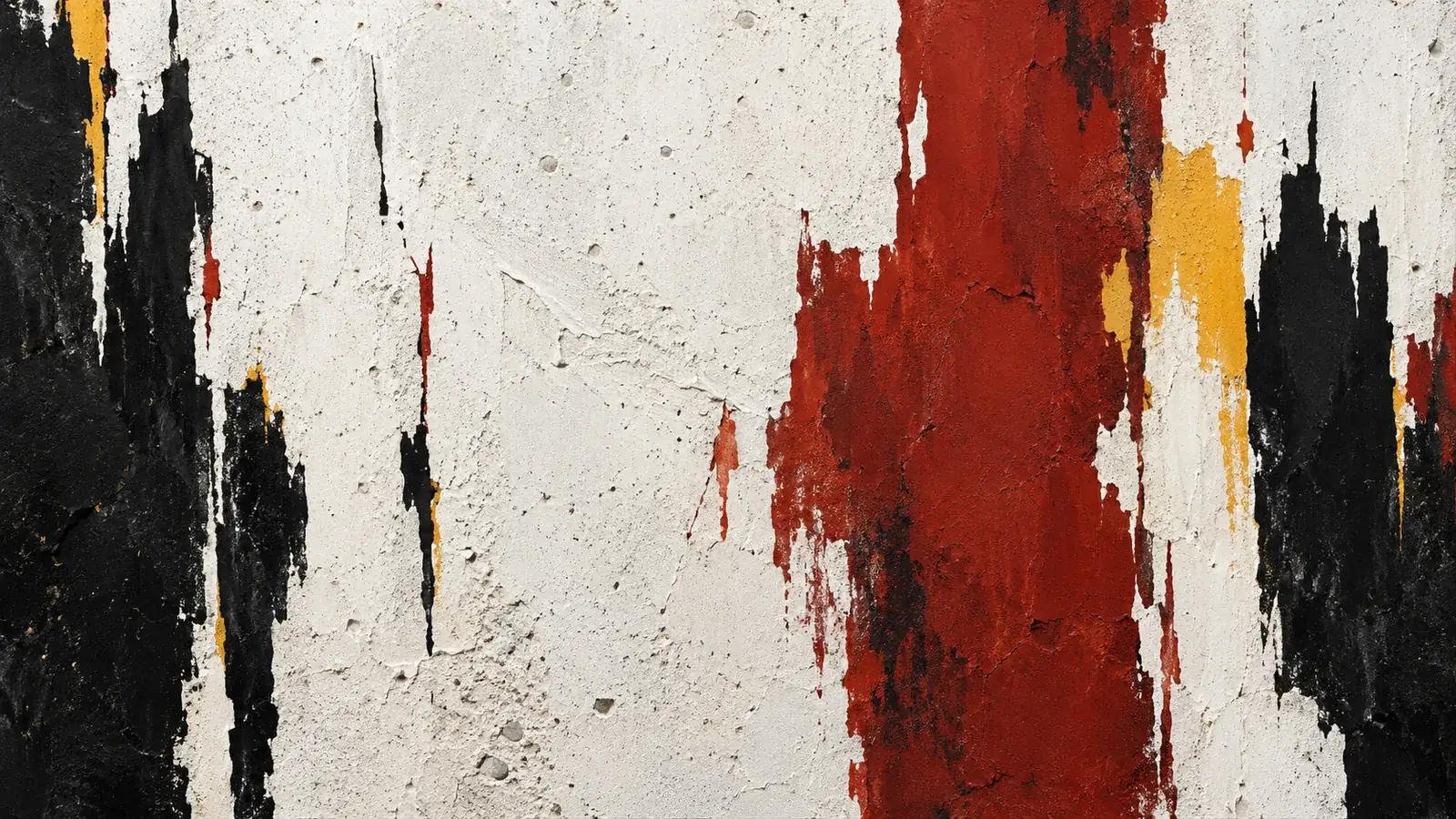 Free gestural red, black and yellow fields with ragged vertical edges on a porous white concrete surface
