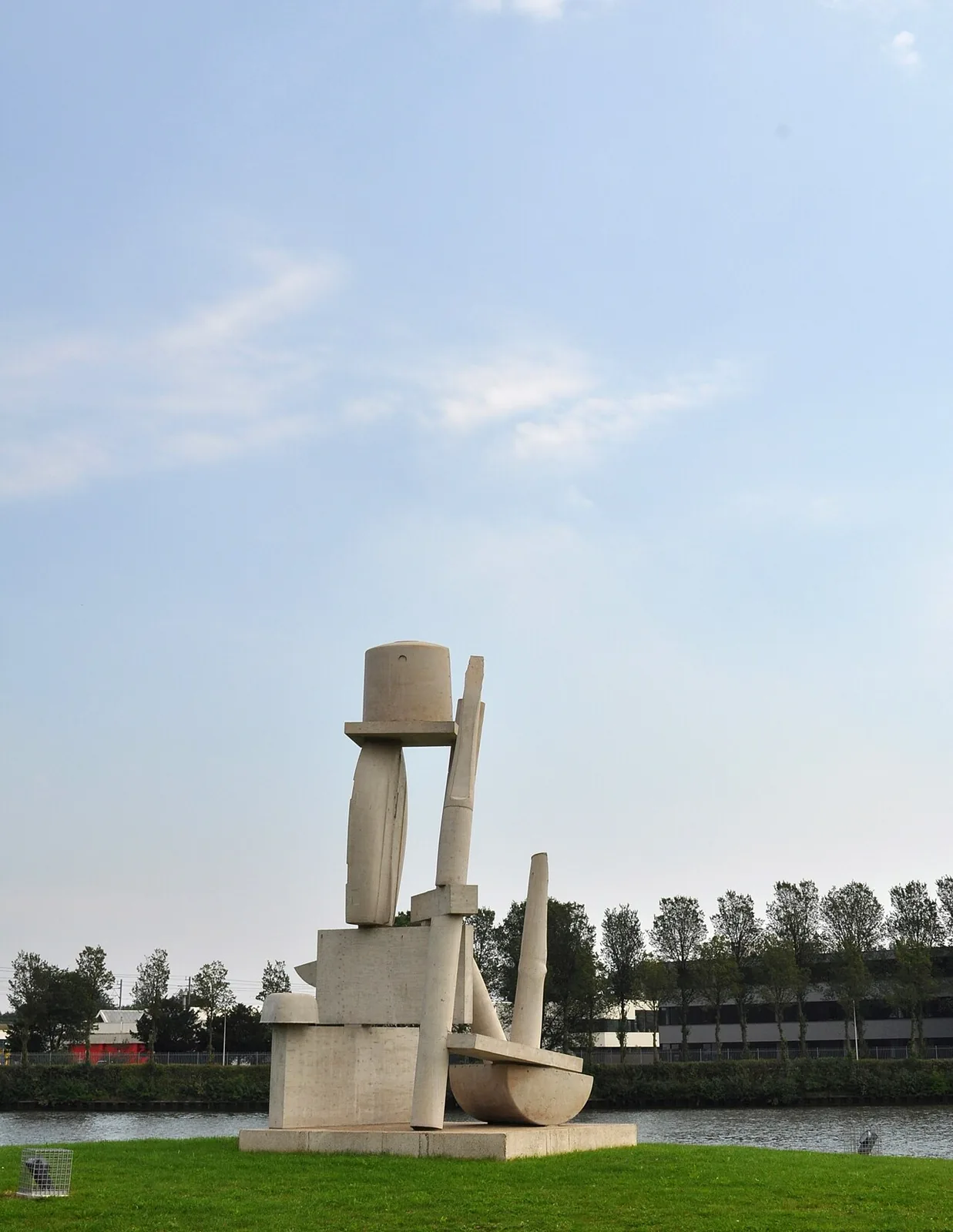 Ruud Kuijer’s balanced concrete forms beside the Amsterdam-Rhine Canal and industrial landscape