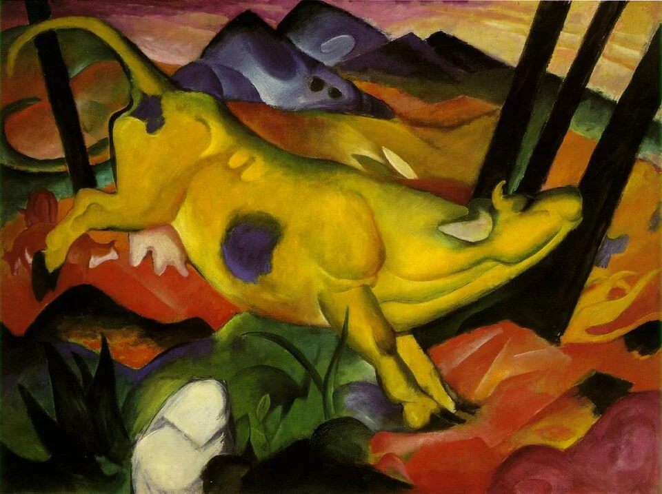 A bright yellow cow leaps across a landscape of contrasting coloured forms