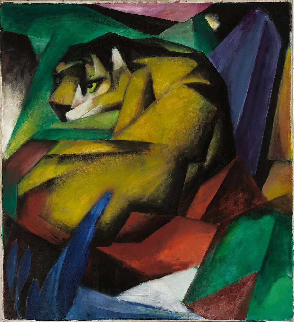 An angular crouching tiger turns its head within a tightly faceted coloured setting