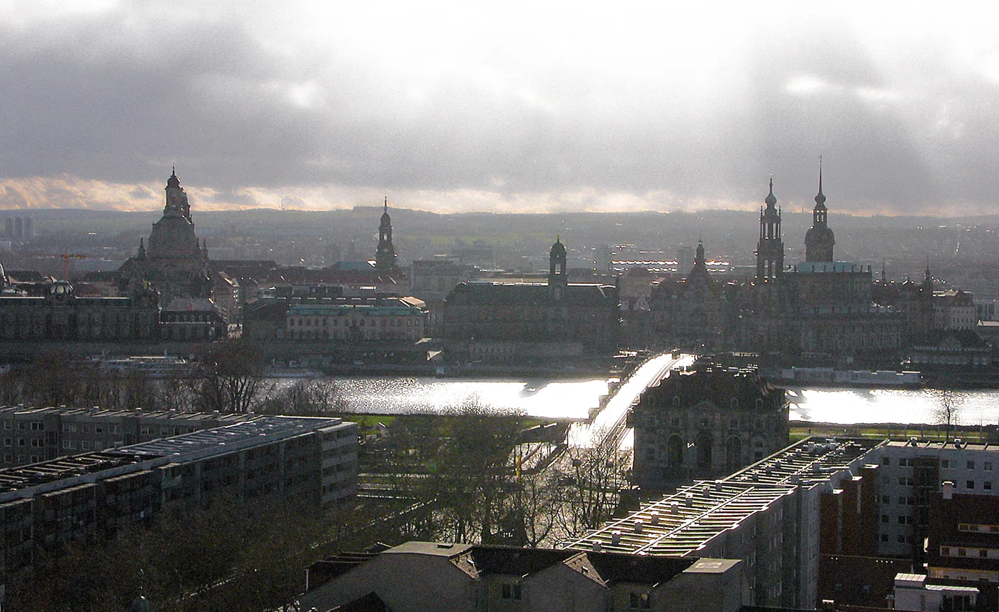 Panorama of Dresden’s old town across the Elbe in low winter light, with the Frauenkirche dome and the Hofkirche towers