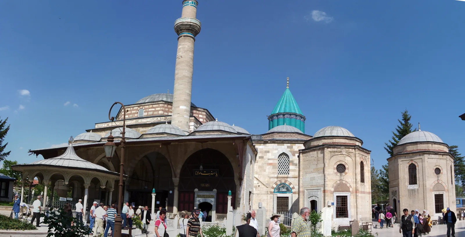Mevlana Museum courtyard and turquoise conical dome in Konya