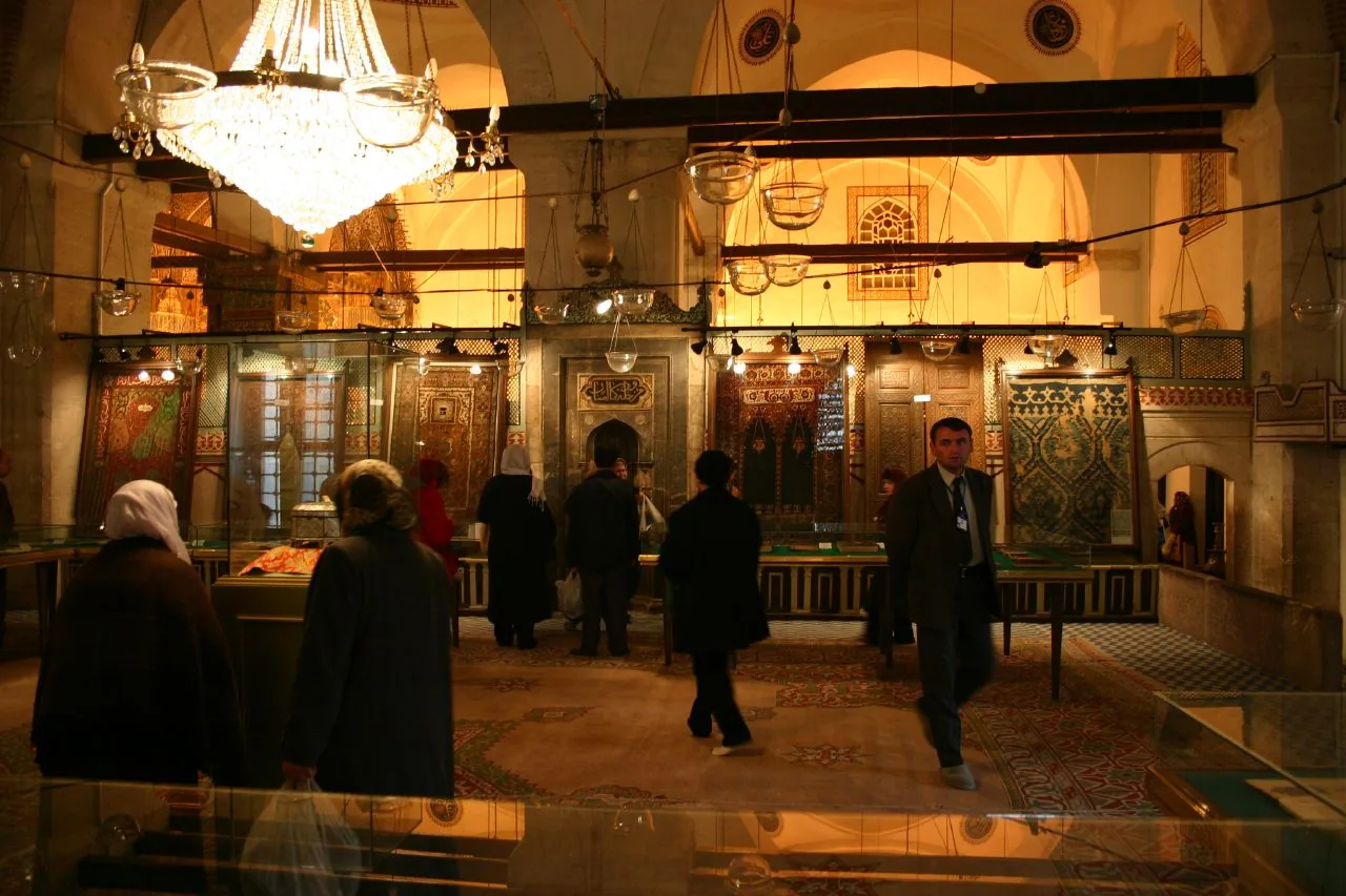 Rumi’s covered tomb beneath the decorated arches of the Mevlana mausoleum