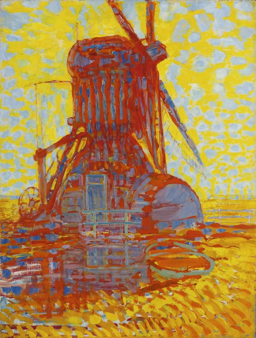 Bright red windmill with blue shadow and a cross of sails against a yellow and blue sky