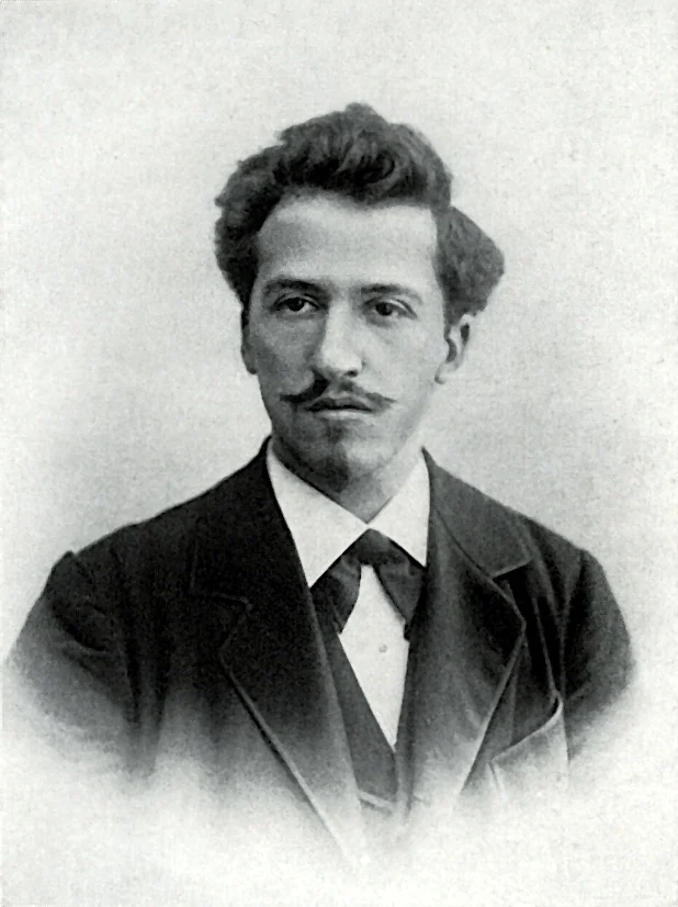 Black-and-white portrait of the young Piet Mondriaan, wearing a dark jacket and looking to the side