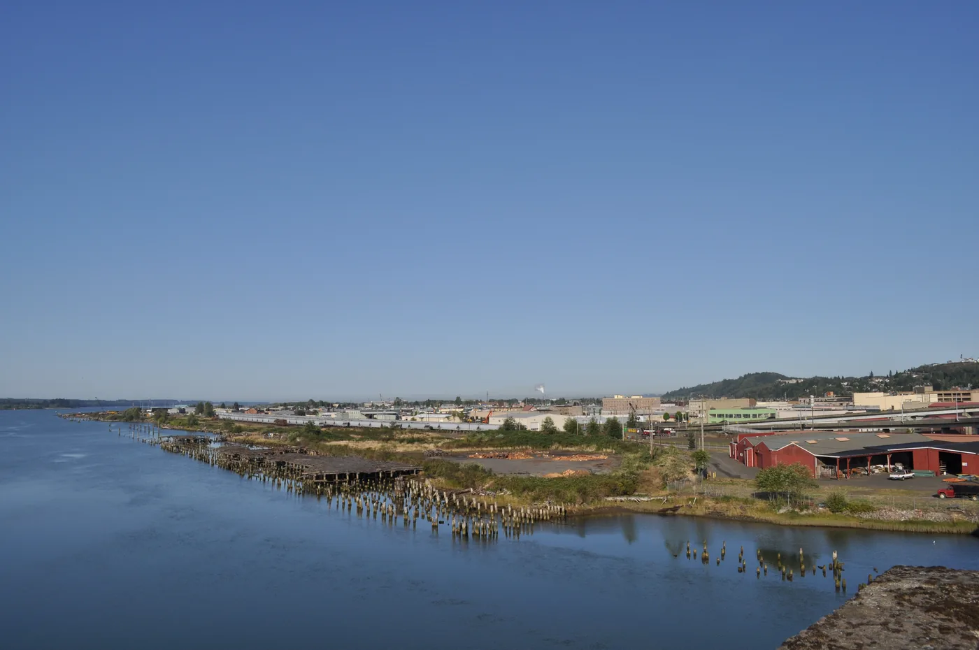 Downtown Aberdeen, Washington, seen across the Chehalis River from Route 101, low buildings under a grey sky