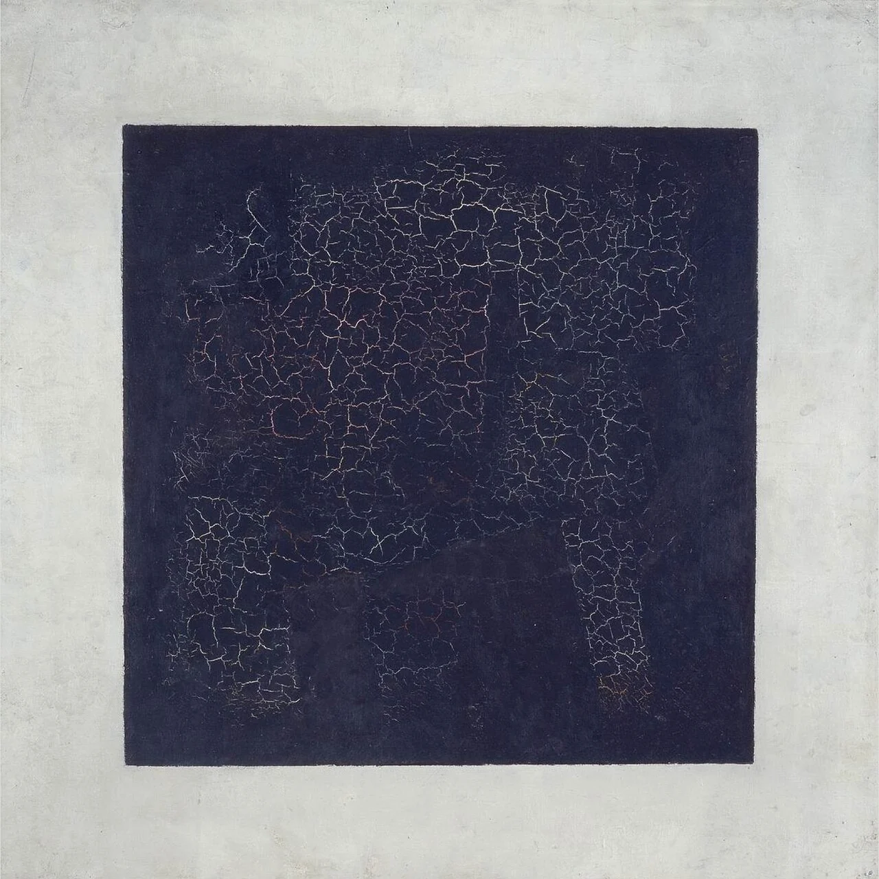 A large black quadrilateral with a visibly cracked surface sits inside pale borders