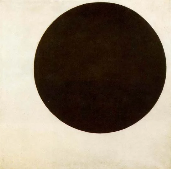 Black circular form floats within a square off-white field